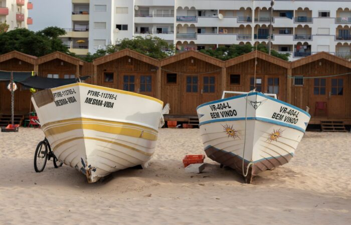 Colorful fishing boats resting on sandy Monte Gordo beach, Faro, Portugal. Colorful fishing boats resting on sandy Monte Gordo beach, Faro, Portugal.