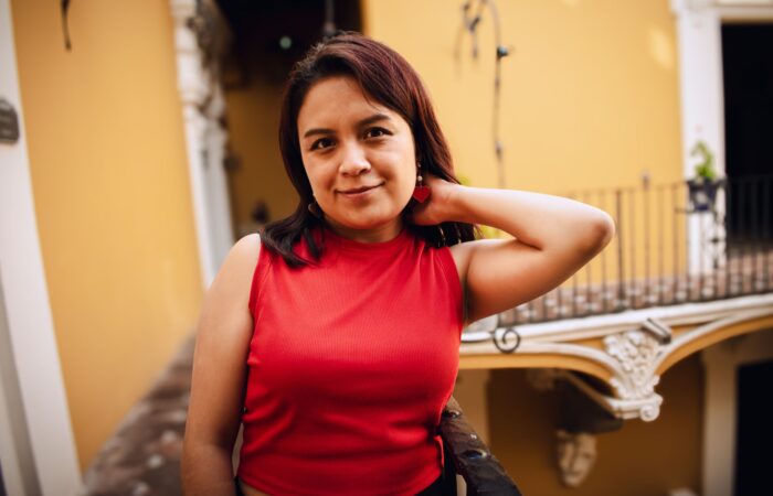 Charming portrait of a woman in a red top in Puebla, Mexico Charming portrait of a woman in a red top in Puebla, Mexico